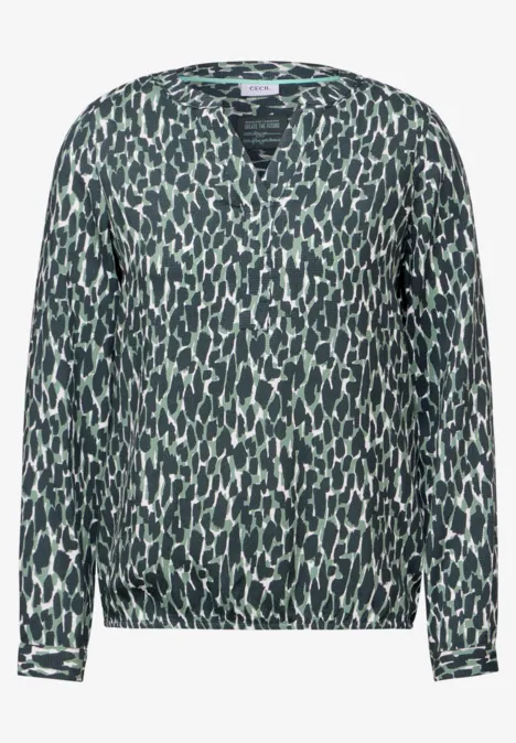Langärmlige Bluse mit abstraktem schwarz-grünem Muster.